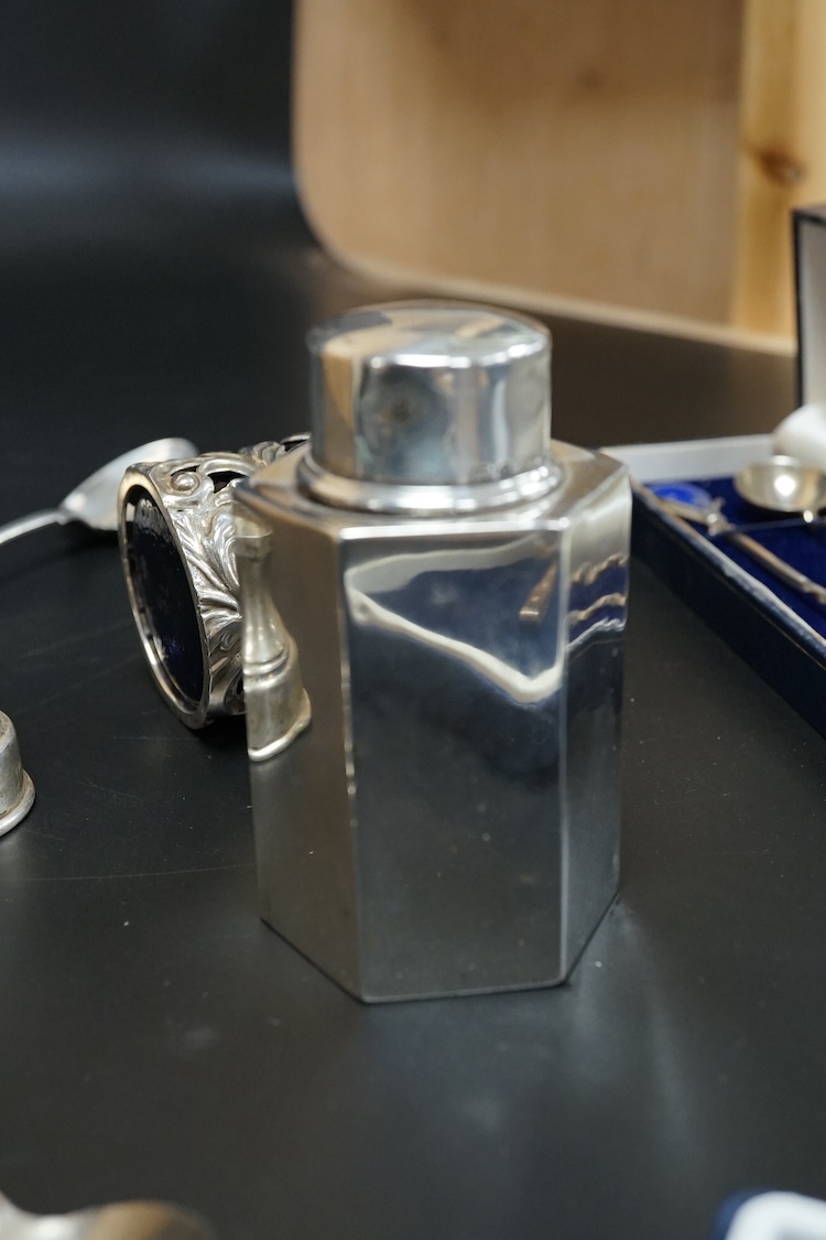 A small group of collectable silver including a pair of modern 925 and lapis lazuli set cocktail stirring spoons, an Edwardian small hexagonal tea caddy, a late Victorian pierced silver salt with blue glass liner and eig